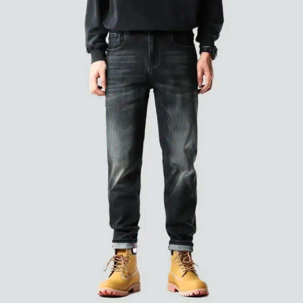 Whiskered men's tapered jeans